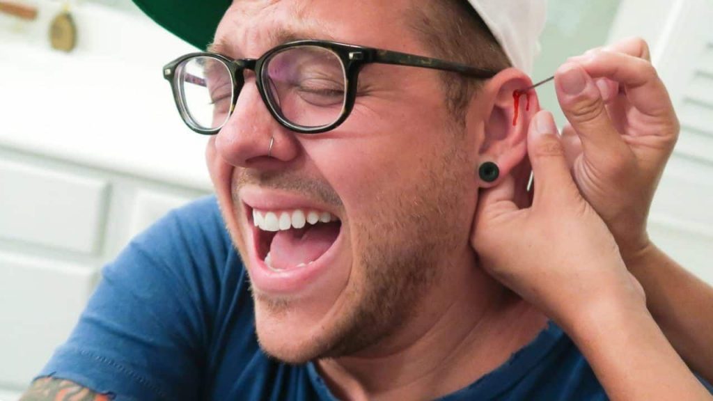 Man Gets Ears Pierced